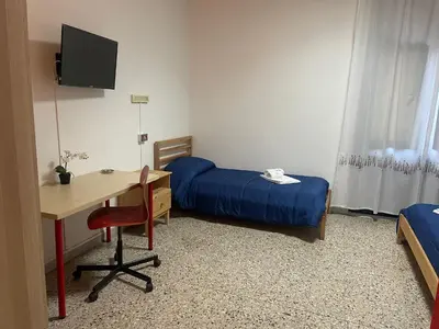 Letto o letti in una camera di Beteyà Hostel Don Bosco