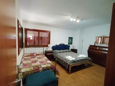Letto o letti in una camera di Casa di Lu’