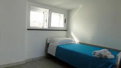 Letto o letti in una camera di Casa Vacanza Miramare