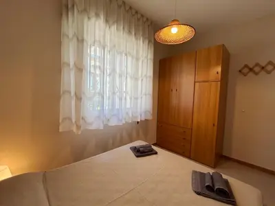 Letto o letti in una camera di Red house near the sandy beach, parking & wi-fi