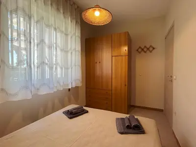Letto o letti in una camera di Red house near the sandy beach, parking & wi-fi