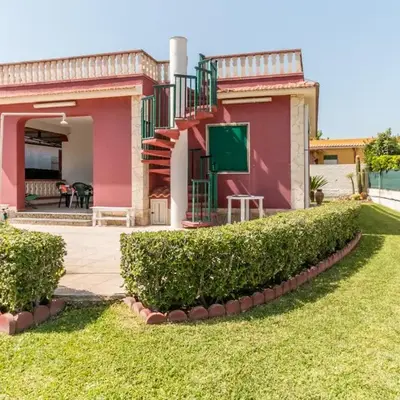 Red house near the sandy beach