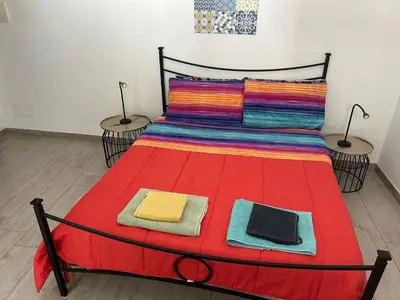 Letto o letti in una camera di Deni's apartments per 2 con veranda balcone