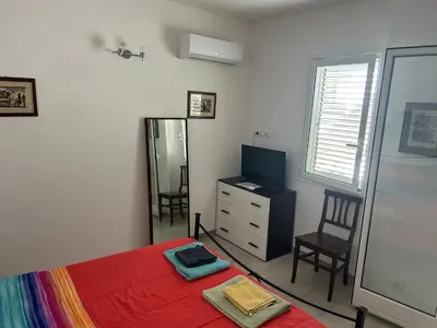 Letto o letti in una camera di Deni's apartments per 2 con veranda balcone