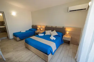 Letto o letti in una camera di Fuori Rotta