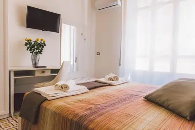 Letto o letti in una camera di Residenza Macos one