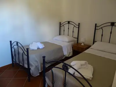 Letto o letti in una camera di B&B Villa Matari