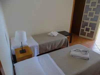 Letto o letti in una camera di B&B Villa Matari
