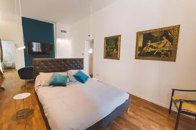 Letto o letti in una camera di Suites of the Royal Council