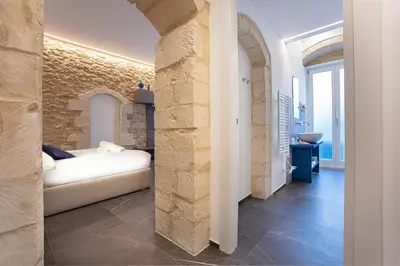 Letto o letti in una camera di Ad Maiora - Design Rooms