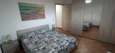 Letto o letti in una camera di Casa Isola Correnti a 50mt dalla spiaggia