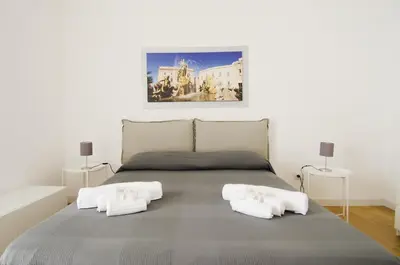 Letto o letti in una camera di La terrazza di Archimede- Ortigia Holidays