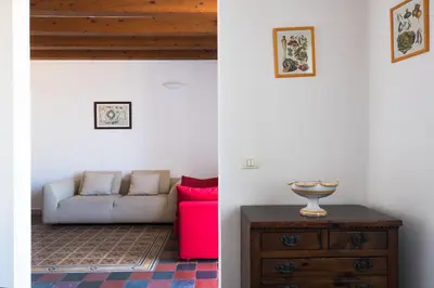 Area soggiorno di Aretusa Apartments by Wonderful Italy