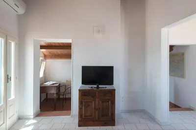 TV o dispositivi per l'intrattenimento presso Aretusa Apartments by Wonderful Italy