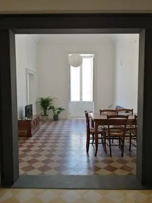 Area soggiorno di Antico Mercato Ortigia Apartment