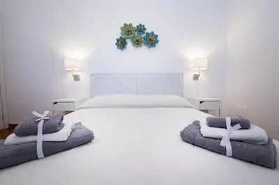 Letto o letti in una camera di Venti del Sud Appartamenti Affitti Brevi