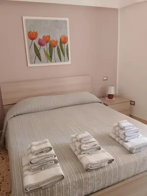 Letto o letti in una camera di Casa Calliope