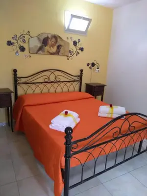 Letto o letti in una camera di CASALE HIBISCUS