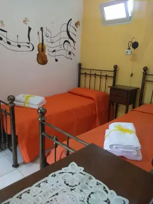 Letto o letti in una camera di CASALE HIBISCUS