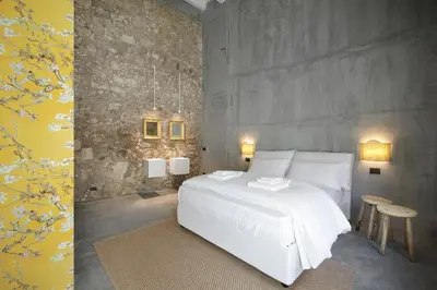 Letto o letti in una camera di ISONZO SUITES