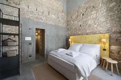 Letto o letti in una camera di ISONZO SUITES
