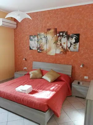 Letto o letti in una camera di DIMORA SANTA LUCIA 2.0