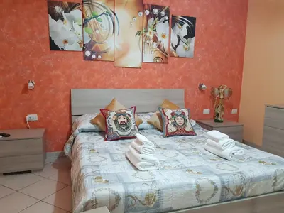 Letto o letti in una camera di DIMORA SANTA LUCIA 2.0