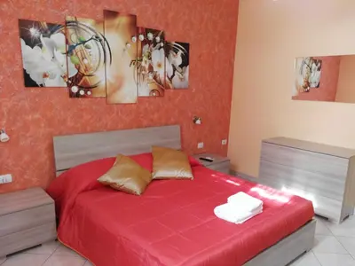 Letto o letti in una camera di DIMORA SANTA LUCIA 2.0