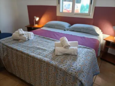 Letto o letti in una camera di VILLA TAI