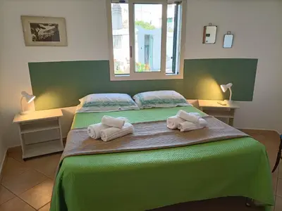 Letto o letti in una camera di VILLA TAI