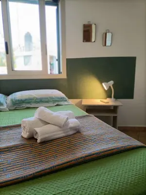 Letto o letti in una camera di VILLA TAI