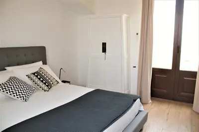 Letto o letti in una camera di TOREMARE SUITE MARZAMEMI
