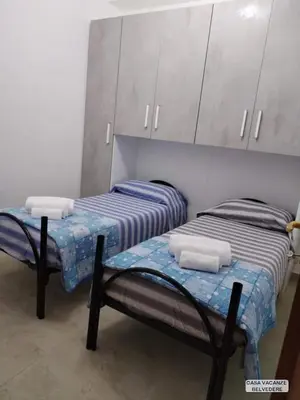 Letto o letti in una camera di Casa Belvedere