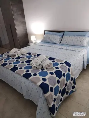Letto o letti in una camera di Casa Belvedere