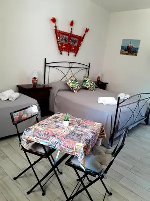 Letto o letti in una camera di Sicilia Room