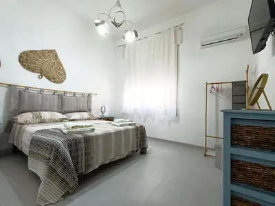 Letto o letti in una camera di Casa Bise
