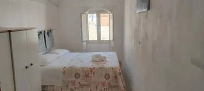 Letto o letti in una camera di La Torretta di Ognina