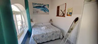 Letto o letti in una camera di La Torretta di Ognina