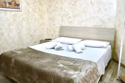 Letto o letti in una camera di Liotru House Catania
