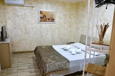 Letto o letti in una camera di Liotru House Catania
