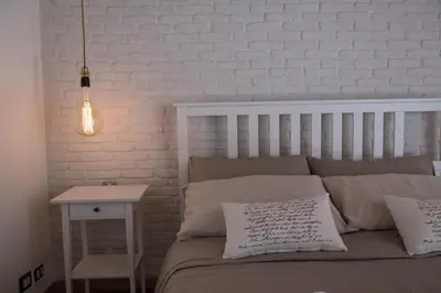 Letto o letti in una camera di Qui ed Ora,Guest house.