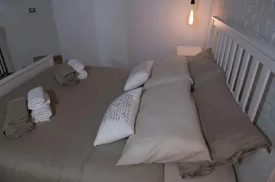 Letto o letti in una camera di Qui ed Ora,Guest house.