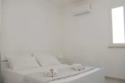 Letto o letti in una camera di Almaga Apartments - San Lorenzo, Marzamemi