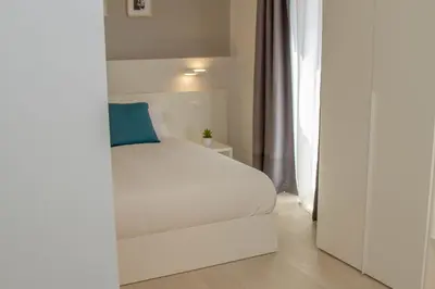 Letto o letti in una camera di Le Suite del Corso