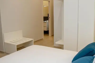 Letto o letti in una camera di Le Suite del Corso