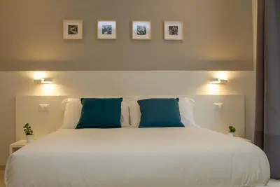 Letto o letti in una camera di Le Suite del Corso
