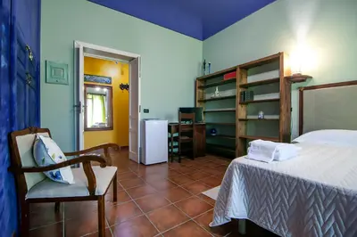 Letto o letti in una camera di A Naca Suite with Private Terrace Ortigia - without kitchen