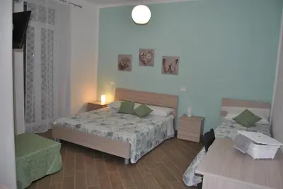 Letto o letti in una camera di La Triade affittacamere