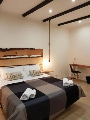 Letto o letti in una camera di B&B Gisira