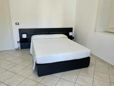 Letto o letti in una camera di Casa Don Minzoni - Affitti brevi